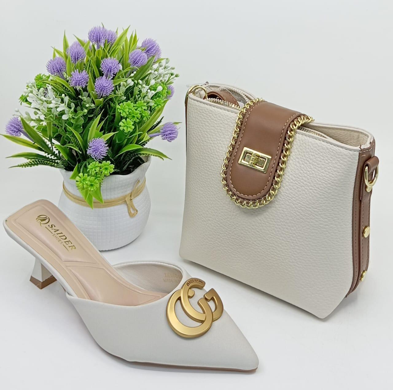 Complete your look with this elegant handbag & matching heels set – perfect for any occasion! 💃