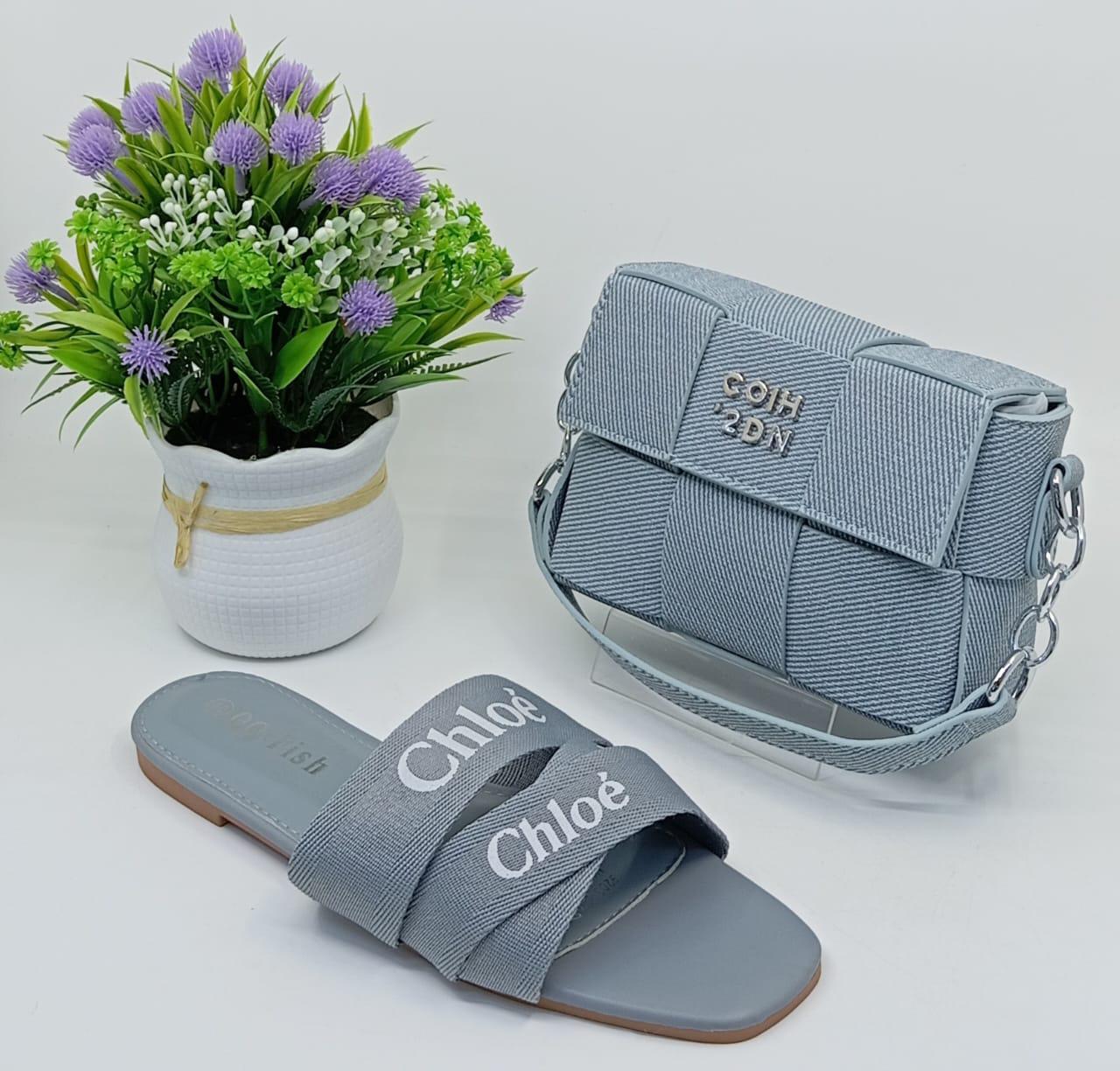 Stylish Matching Set – Includes a trendy shoulder bag and elegant slip-on sandals in coordinating silver tones.
