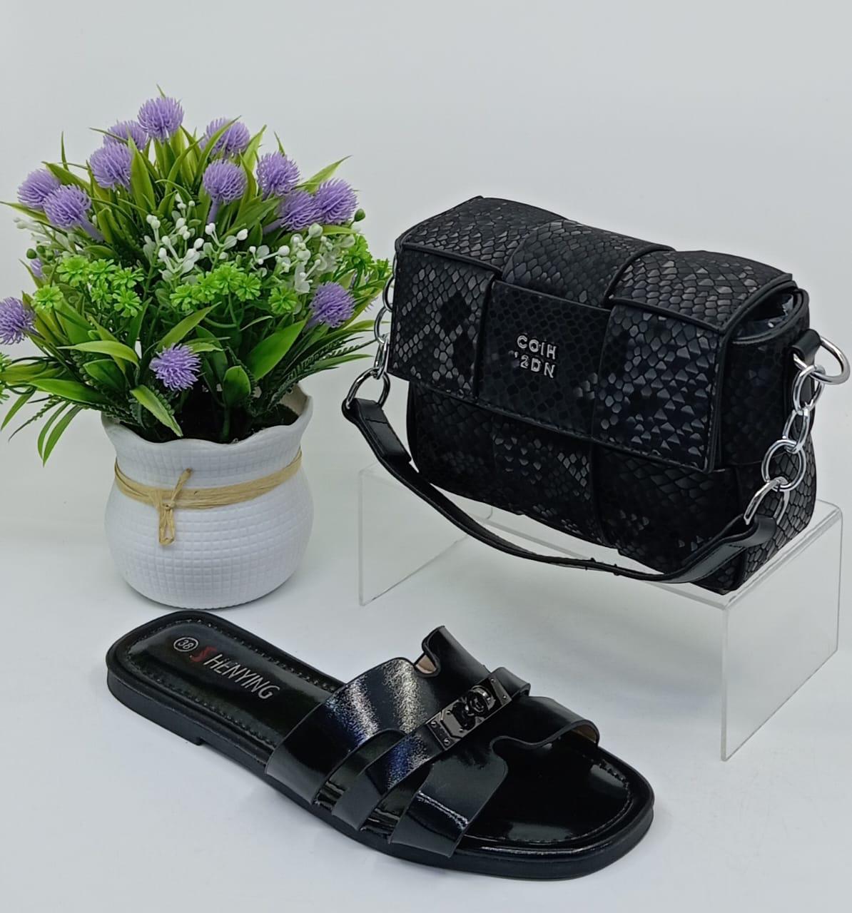 Stylish Matching Set – Includes a trendy shoulder bag and elegant slip-on sandals in coordinating silver tones.