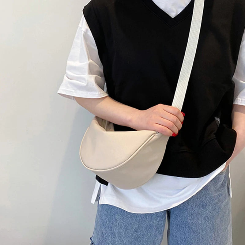 Women's single-shoulder bag - shaped like a dumpling, with a single zipper, can be worn diagonally across the shoulder.