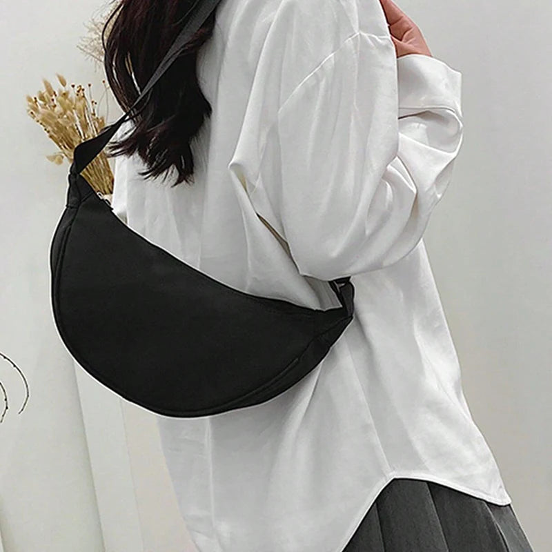 Women's single-shoulder bag - shaped like a dumpling, with a single zipper, can be worn diagonally across the shoulder.