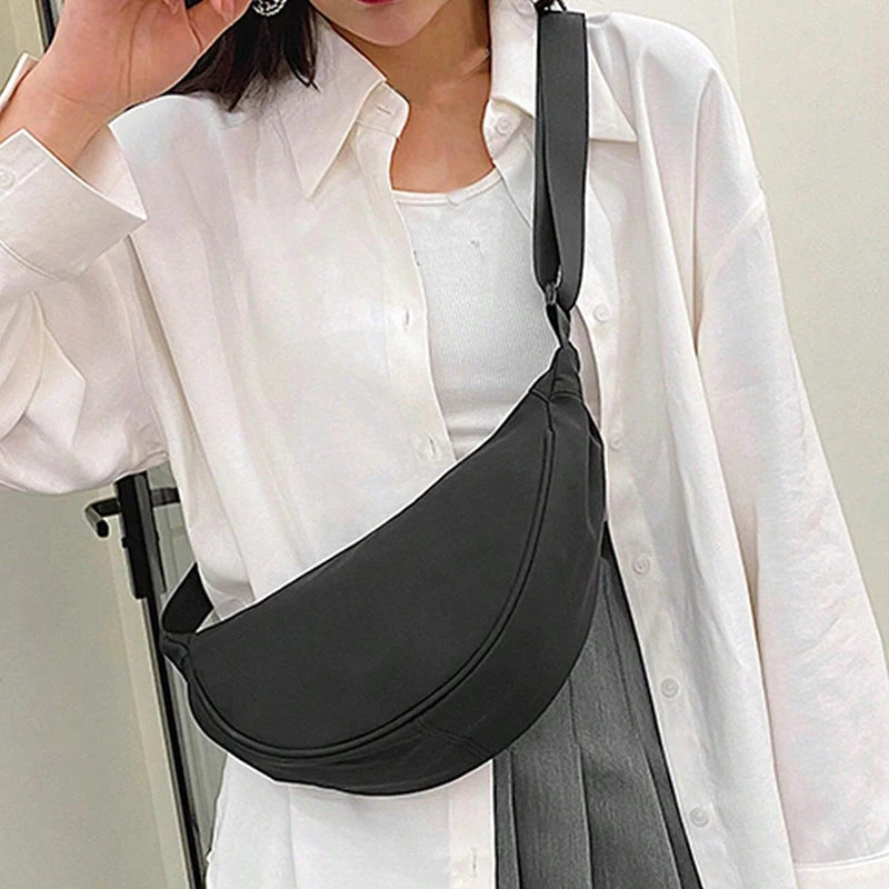 Women's single-shoulder bag - shaped like a dumpling, with a single zipper, can be worn diagonally across the shoulder.