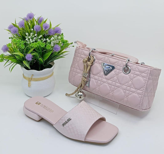 Stylish Matching Set – Includes a trendy shoulder bag and elegant slip-on sandals in coordinating silver tones.
