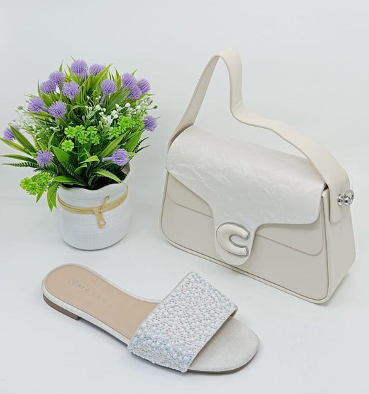 The handbag and sandals together create a coordinated, elegant look—ideal for parties, casual outings, or gift sets.